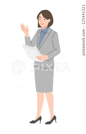 A woman in a suit holding documents and talking 125441321