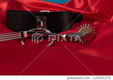 Adult sex games. Kinky lifestyle. Spank on the red linen. Bdsm outfit 125441579