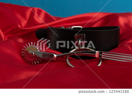 Adult sex games. Kinky lifestyle. Spank on the red linen. Bdsm outfit 125441580