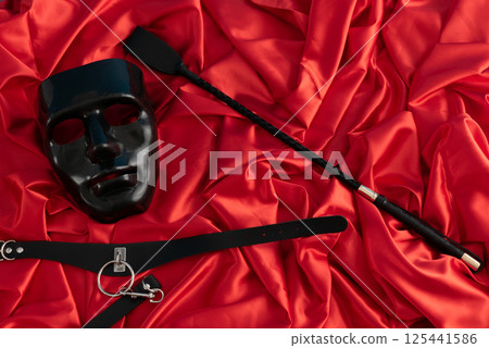 Adult sex games. Kinky lifestyle. Spank on the red linen. Bdsm outfit 125441586