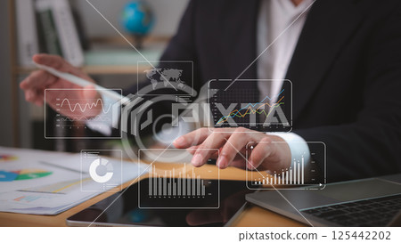 Businessman analytics with key performance indicators, Analyzing company network, Working Data analytics and data management systems and connected to corporate strategy database for finance investment 125442202