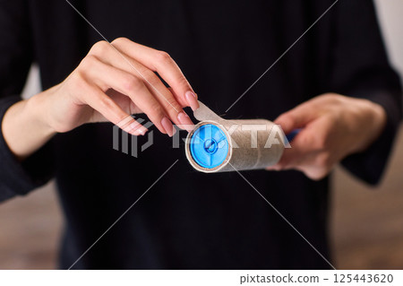 Proper and effective use of a lint roller is essential for keeping your fabrics clean and fresh 125443620