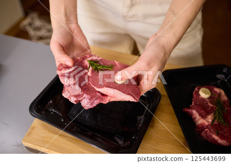Sealing Fresh Meat for Preservation Using a Vacuum Sealer for Longer Lasting Freshness 125443699