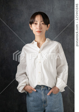Middle-aged woman looking at camera Middle-aged woman looking at camera 125443846