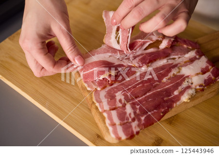 Artisan Style Meat Preparation on a Beautifully Crafted Wooden Board for Serving Artisan Style Meat Preparation on a Beautifully Crafted Wooden Board for Serving 125443946