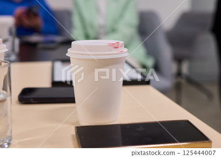 A Casual Coffee Meeting that Incorporates Digital Devices for Enhanced Productivity and Enjoyment A Casual Coffee Meeting that Incorporates Digital Devices for Enhanced Productivity and Enjoyment 125444007