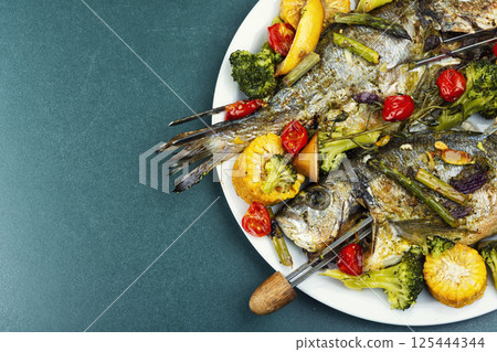 Fried dorado fish, seafood shashlik. Fried dorado fish, seafood shashlik. 125444344