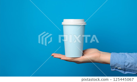 Hand holding a cup mockup image 125445067