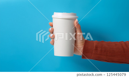 Hand holding a cup mockup image Hand holding a cup mockup image 125445079