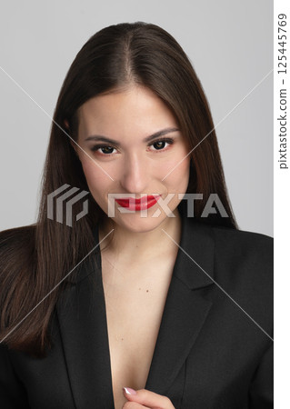 Beautiful woman with red lips and black hair portrait 125445769