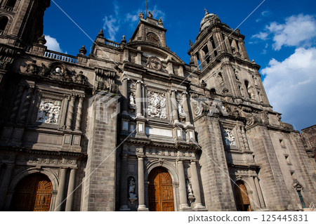 Facade of the historical Metropolitan Cathedral of Mexico City built between 1573 and 1813. Metropolitan Cathedral of the Assumption of the Most Blessed Virgin Mary into Heaven. Facade of the historical Metropolitan Cathedral of Mexico City built between 1573 and 1813. Metropolitan Cathedral of the Assumption of the Most Blessed Virgin Mary into Heaven. 125445831