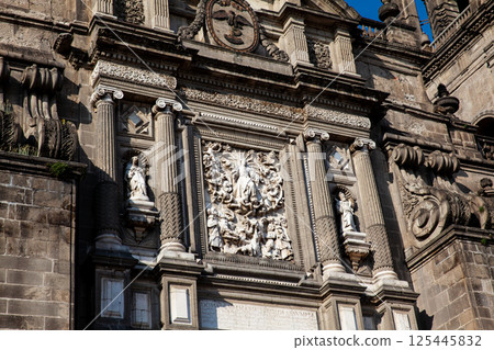 Facade of the historical Metropolitan Cathedral of Mexico City built between 1573 and 1813. Metropolitan Cathedral of the Assumption of the Most Blessed Virgin Mary into Heaven. 125445832