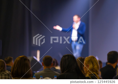 Speaker addressing audience at a business presentation or conference event Speaker addressing audience at a business presentation or conference event 125445926