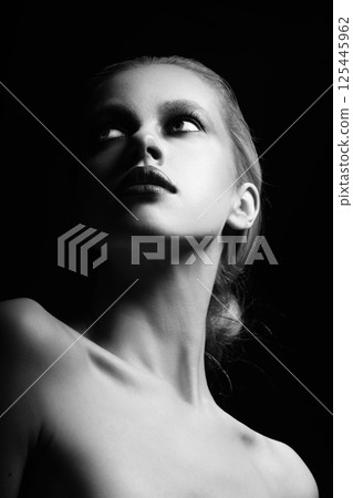 Beautiful woman with fancy make-up close-up studio portrait Beautiful woman with fancy make-up close-up studio portrait 125445962