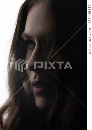 Dark face silhouette of beautiful and sexy woman Dark face silhouette of beautiful and sexy woman 125446112