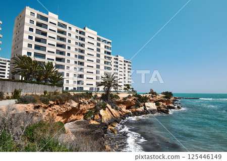 Modern, multi-story white apartment Modern, multi-story white apartment 125446149