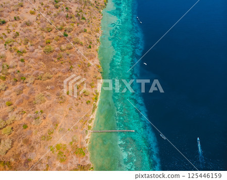 Coastline with diving sites in transparent ocean on Menjangan, Bali. Aerial view Coastline with diving sites in transparent ocean on Menjangan, Bali. Aerial view 125446159