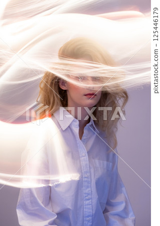 Abstract woman studio portrait with light painting technique Abstract woman studio portrait with light painting technique 125446179
