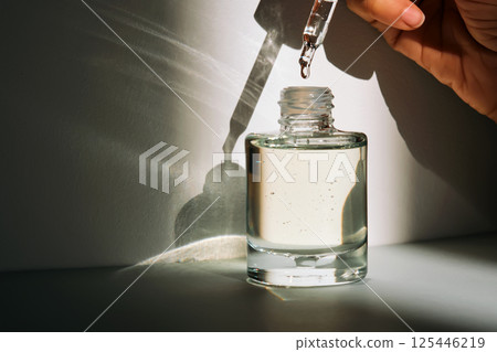 The facial serum drips into a bottle. Lifestyle. 125446219