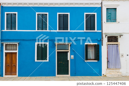 Blue house facade with shutters in Burano Blue house facade with shutters in Burano 125447406