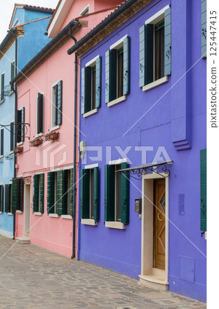 Colorful row of houses with shutters Colorful row of houses with shutters 125447415