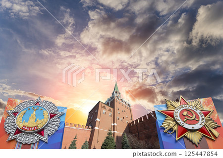 Moscow Kremlin (with orders of victory)--Victory Day celebration (WWII), Russia-- the most popular view. Against the sky with clouds. English translation from Russian: USSR, Victory, Patriotic war 125447854