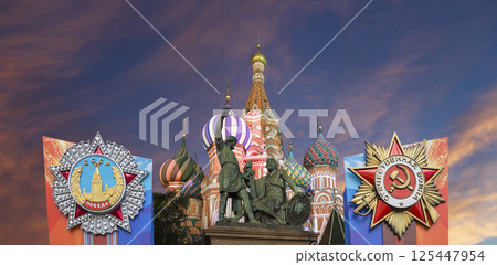 Temple of Basil the Blessed with orders of victory in honor of Victory Day celebration (WWII), Red Square, Moscow, Russia. Against the clouds 125447954