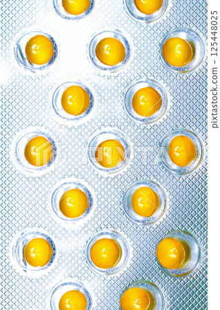 Yellow pills foil 125448025