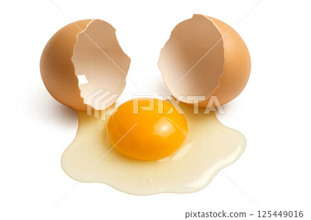 Broken Eggs With Yolk and Whites Spilling on White Surface in Kitchen Setting 125449016