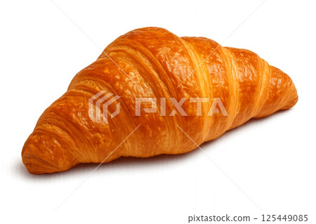 Flaky Golden Croissant Resting on a Clean Surface After Baking in a Cozy Kitchen 125449085
