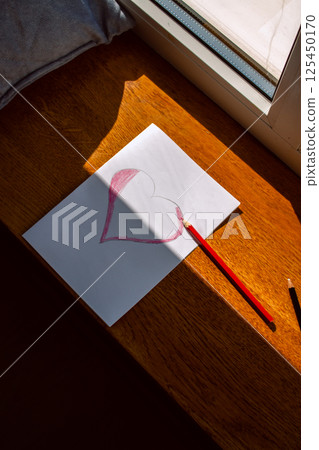 Girl creating handmade greeting card for International Women's Day, Mother's day for mom. Family warmth and generational love. 125450170