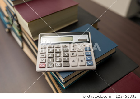 Calculator and book 125450332