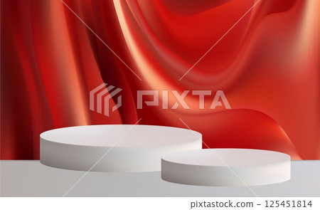White cylindrical podiums elegantly stand out against a backdrop of luxurious red draped fabric. 125451814