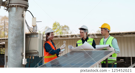 Sustainability and Energy Solutions. A professional team analyzing solar technology and its applications. Sustainability and Energy Solutions. A professional team analyzing solar technology and its applications. 125452021