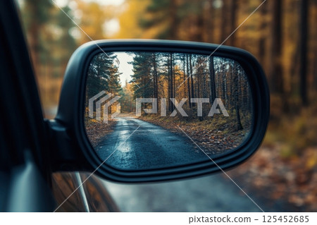 Driving through autumn forests a scenic journey reflecting nature's beauty Driving through autumn forests a scenic journey reflecting nature's beauty 125452685