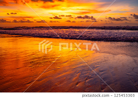 Amazing light sunset or sunrise sky over sea with wave crashing in the ocean,Seascape view nature colorful sky background 125453303