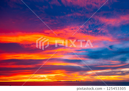 Amazing light sunset or sunrise sky over sea with wave crashing in the ocean,Seascape view nature colorful sky background 125453305
