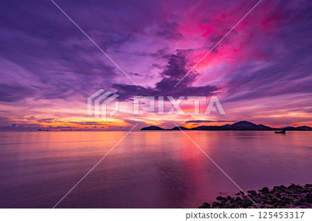 Amazing light sunset or sunrise sky over sea with wave crashing in the ocean,Seascape view nature colorful sky background 125453317