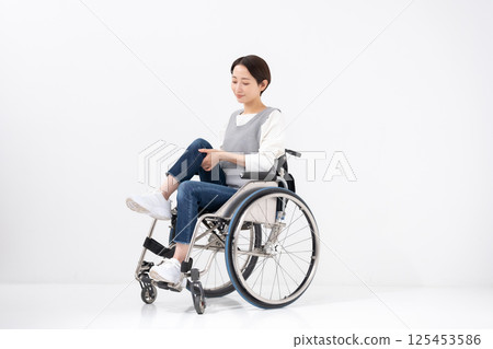 Wheelchair yoga stretching 125453586