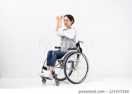 Wheelchair yoga stretching 125453590