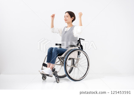 Wheelchair yoga stretching 125453591