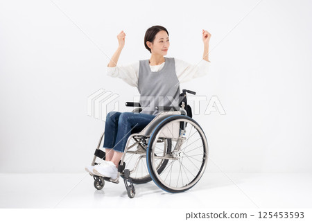 Wheelchair yoga stretching 125453593