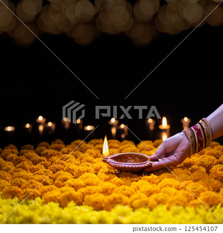 Diwali Traditions and Celebrations Around the World. 125454107