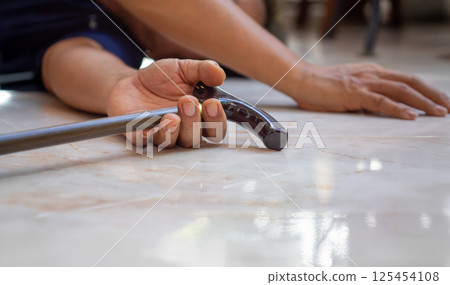 Senior man falling down at home because stumbled on a door kerb. 125454108