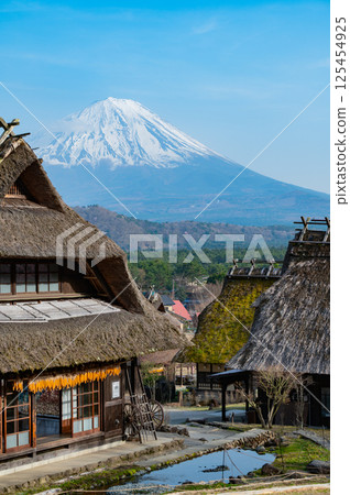 A traditional Japanese landscape with old houses and Mt. Fuji 125454925