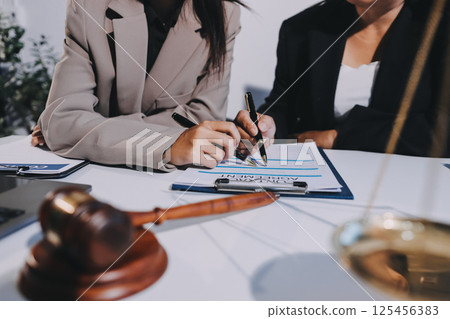 Concept of legal counseling. The lawyer or legal counsel is listening and providing advice to business people. 125456383