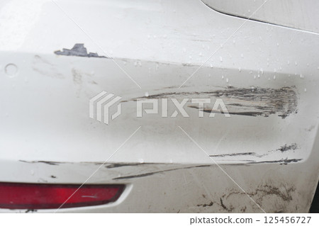 Car bumper with scratches and scuff marks after minor collision 125456727