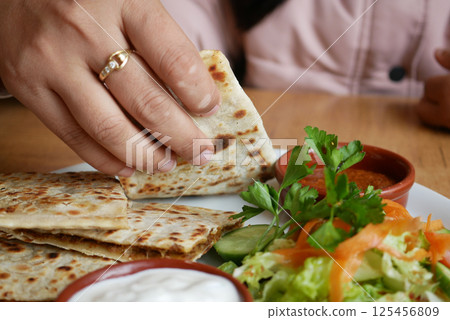 Turkish pancake gozleme on a plate Turkish pancake gozleme on a plate 125456809