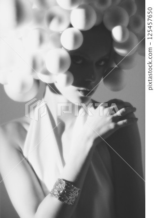 Monochrome Portrait with Spherical Accents 125457650