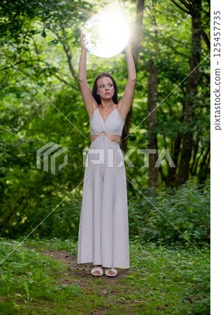 Enchanted Forest Scene with Ethereal Woman Enchanted Forest Scene with Ethereal Woman 125457735